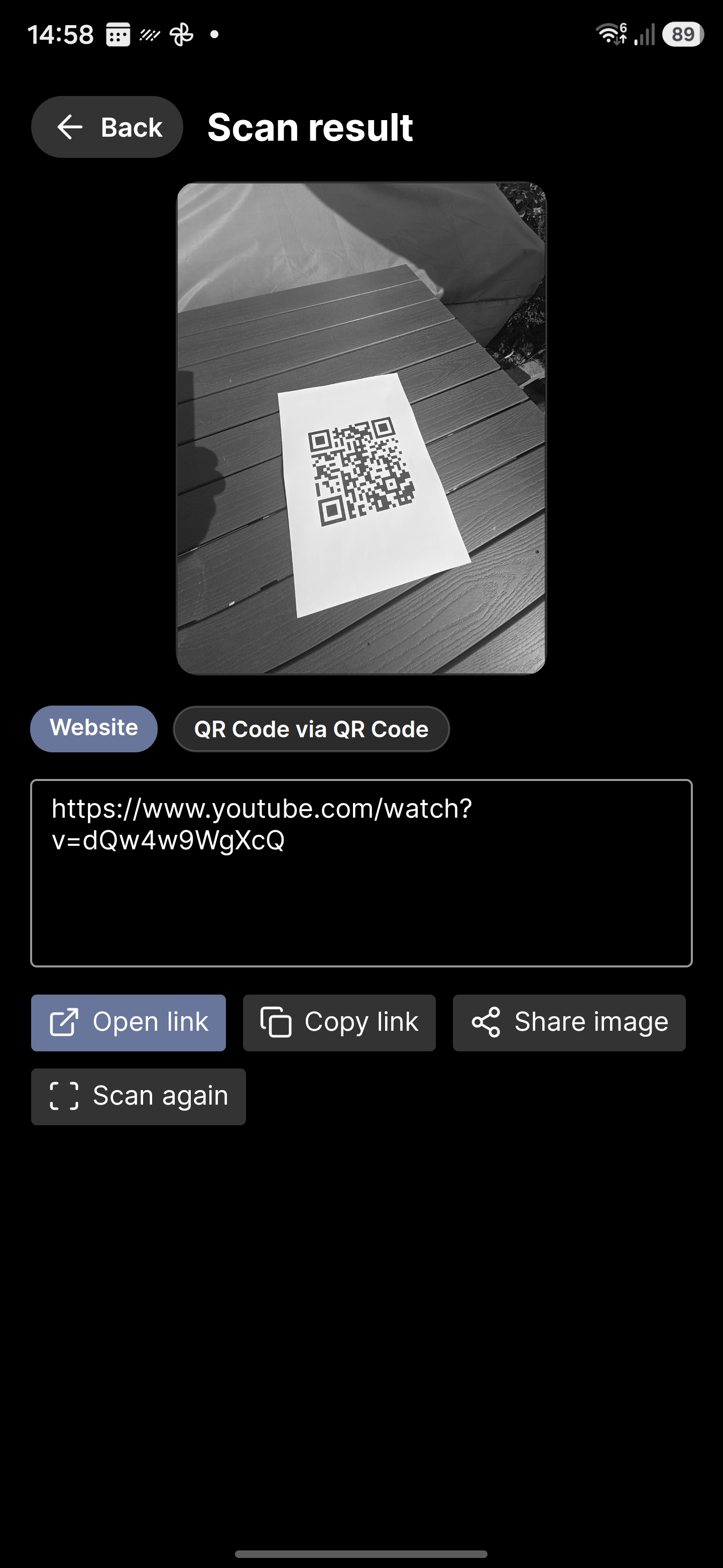 ScannerZero scan result screen showing a decoded website link and action buttons.